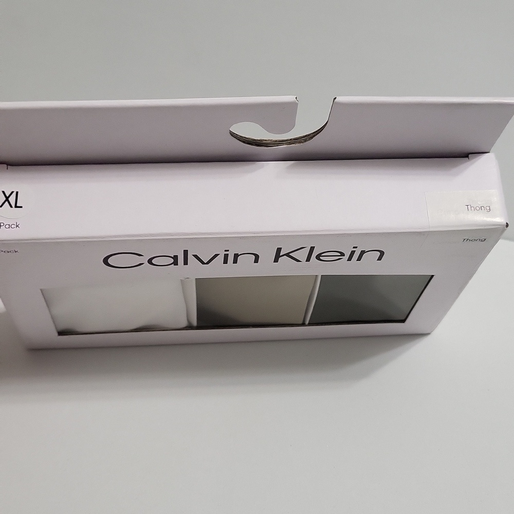 Calvin Klein Thong Trio in White, Tan, and Gray - Picture 3 of 3